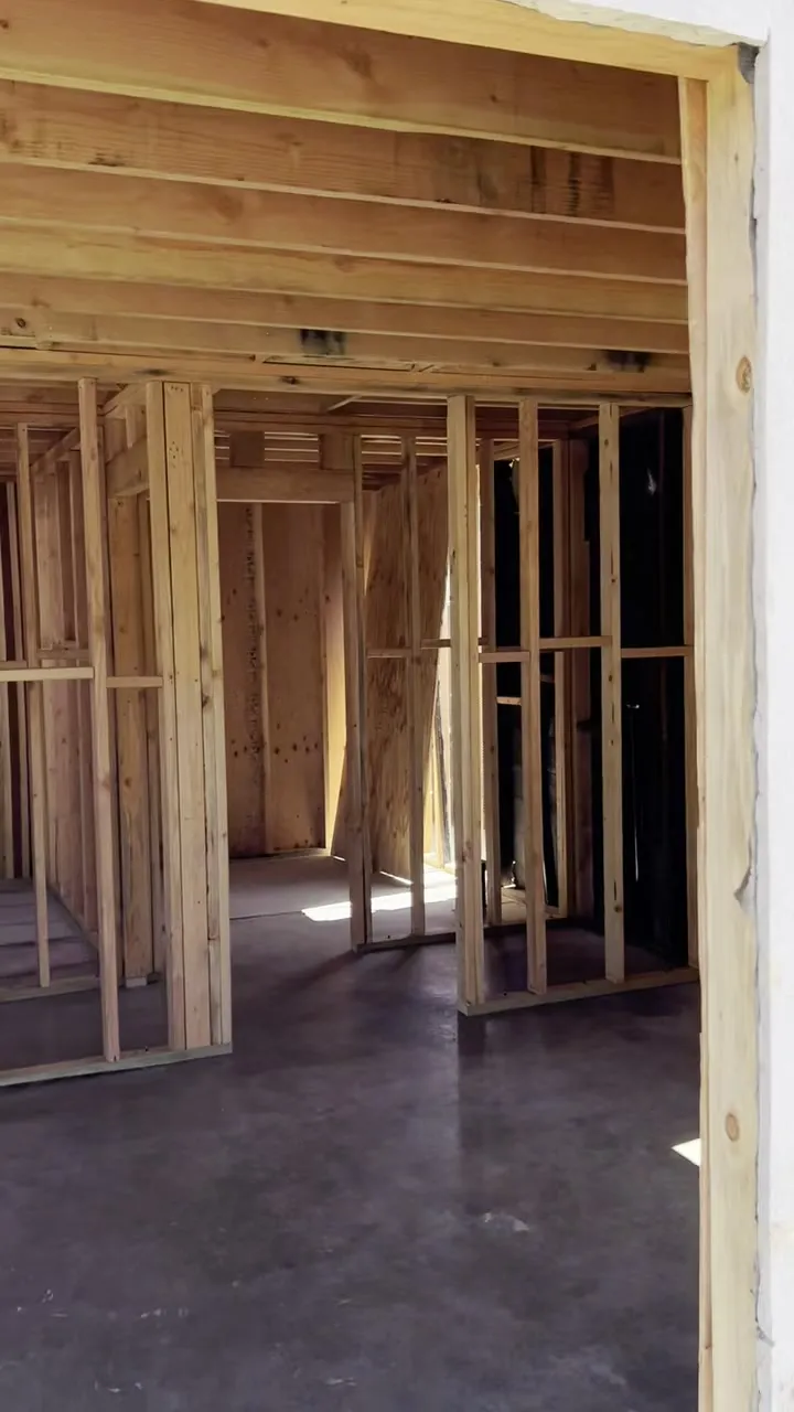 Interior wall framing inside an ADU conversion on a concrete slab